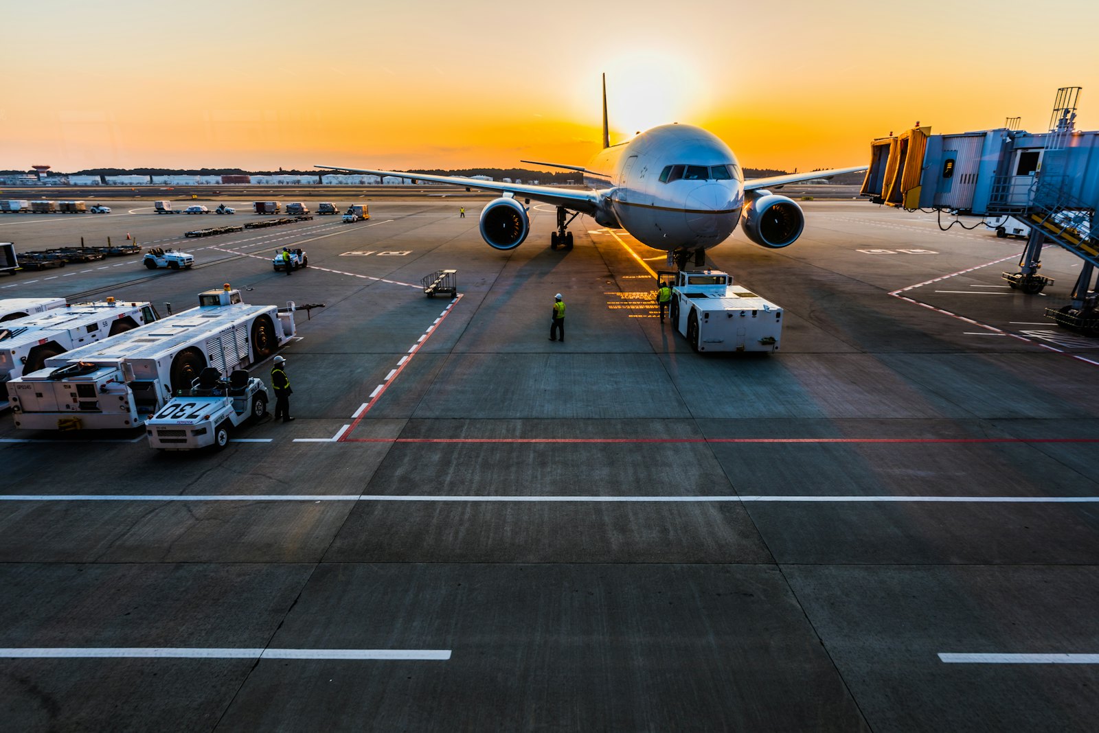 Cargo aircraft at an airport at sunset