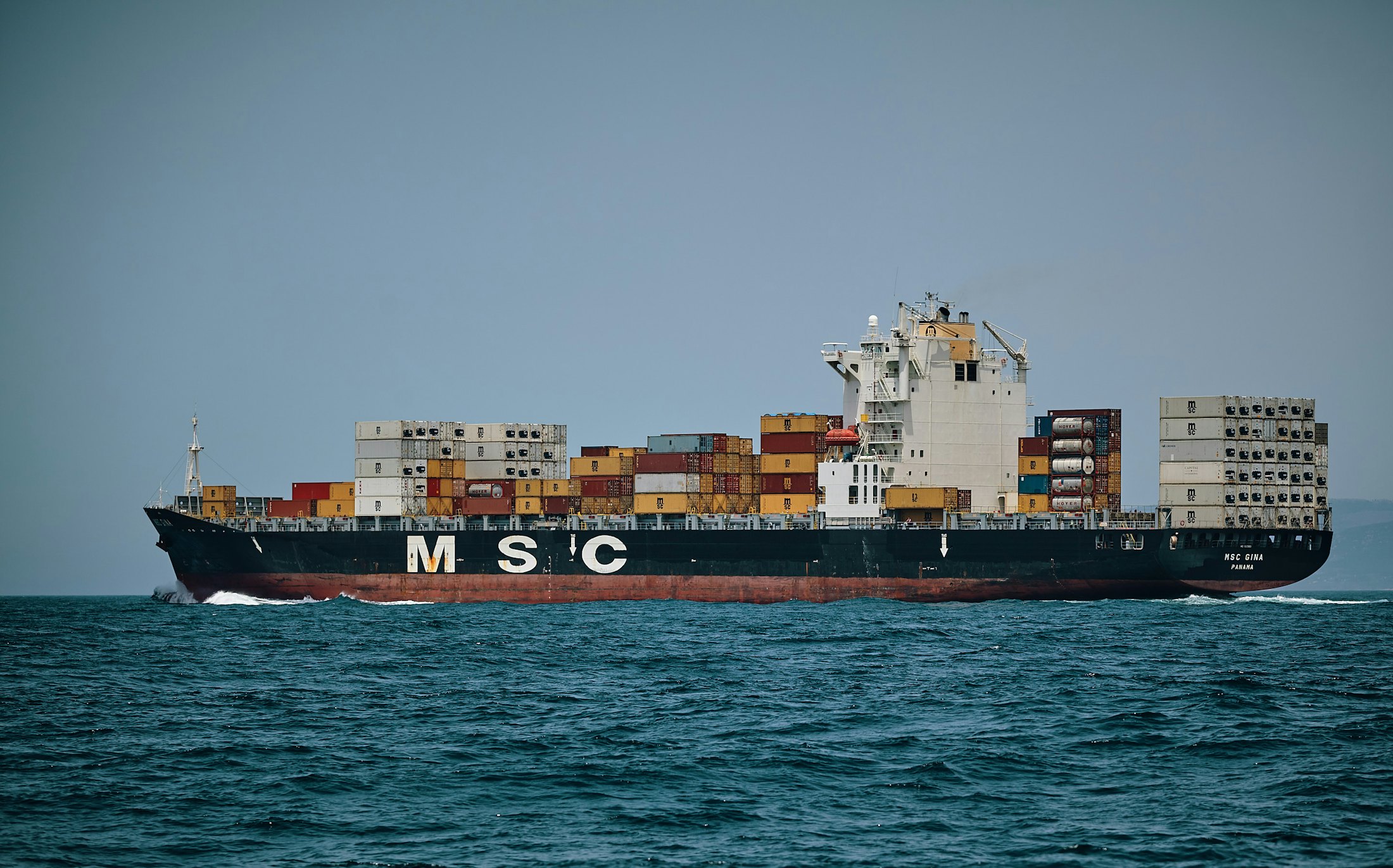 Container ship carrying export cargo